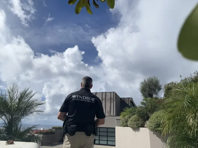 Windsor Security officer watching over a hillside estate