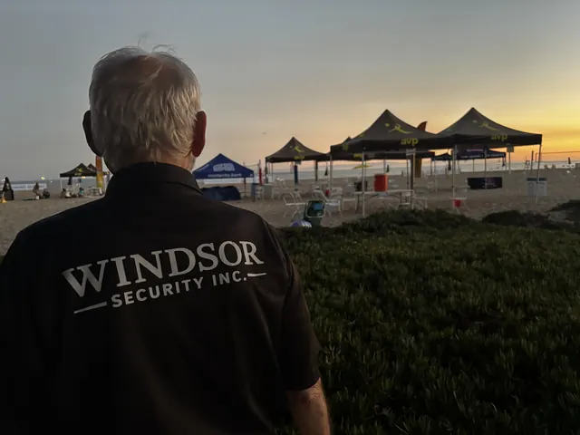 Windsor Security officer on duty at a beach event at sunset