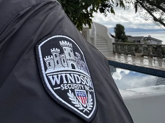 Windsor Security shoulder patch on an officer jacket at a coastal estate