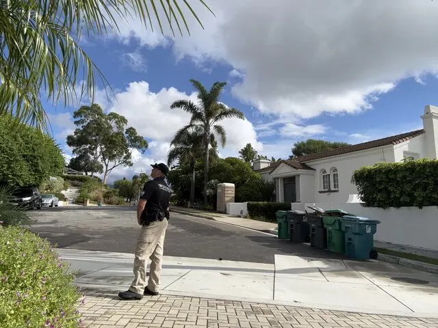 Windsor Security officer on foot patrol along a residential street